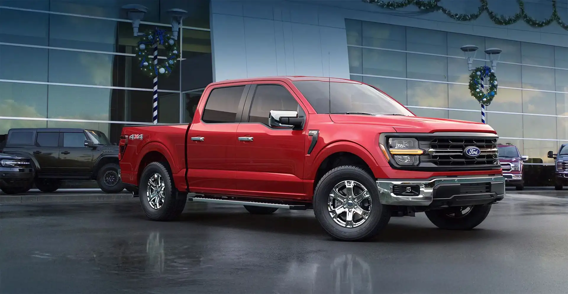 Red pickup truck outside dealership