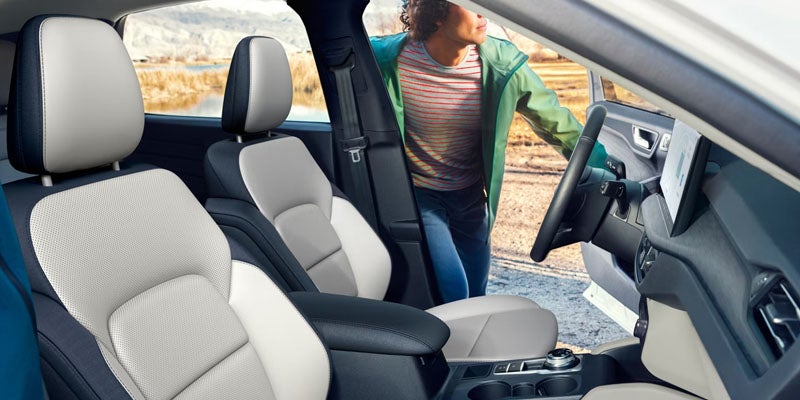 Interior of the 2026 Ford Escape with spacious seating, a panoramic Vista Roof®, and premium materials, designed for comfort and versatility in Bloomington, MN.
