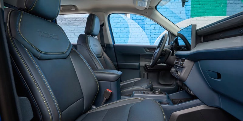 2026 Ford Maverick in Bloomington, MN interior with ActiveX seating, spacious cabin for five passengers, and smart storage solutions.