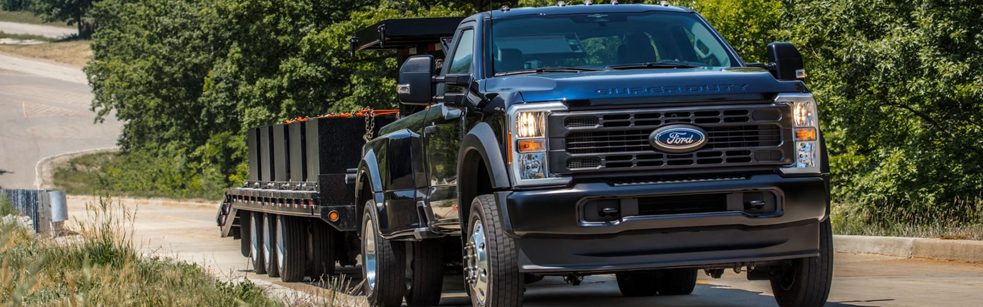 2026 Ford F-250 interior in Bloomington, MN with close-up of infotainment system radio buttons and touchscreen controls.